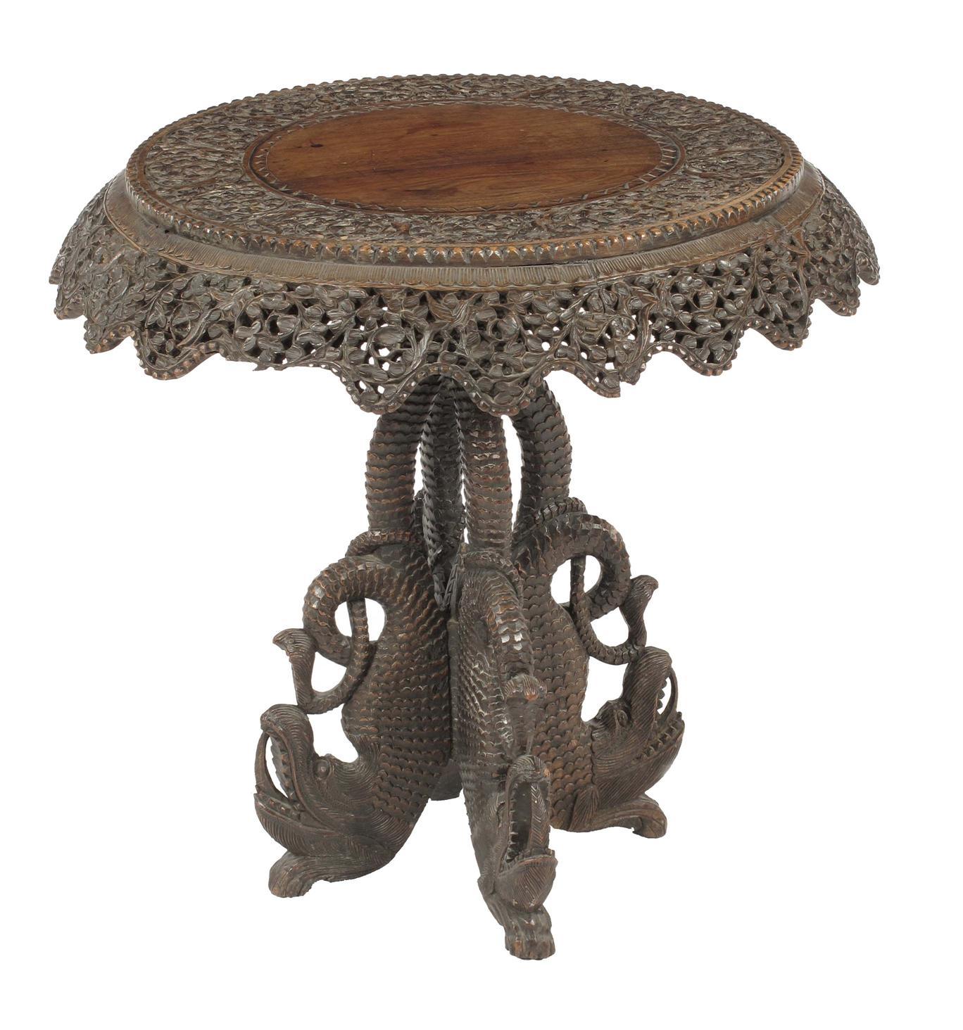 Appraisal: A Burmese carved and pierced hardwood occasional table