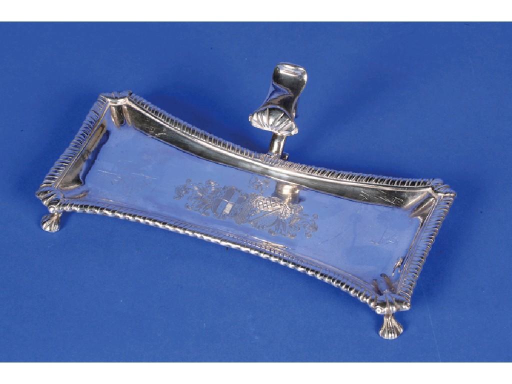 Appraisal: A GEORGE III SNUFFER STAND of shaped rectangular form with