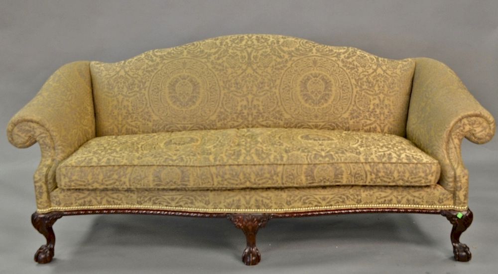 Appraisal: Chippendale style sofa with rolled arms and claw and ball