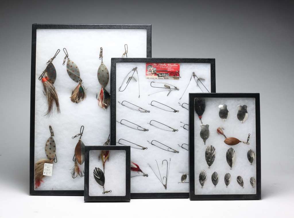 Appraisal: SPOON AND WEEDLESS LURES IN DISPLAY CASES American thir quarter-