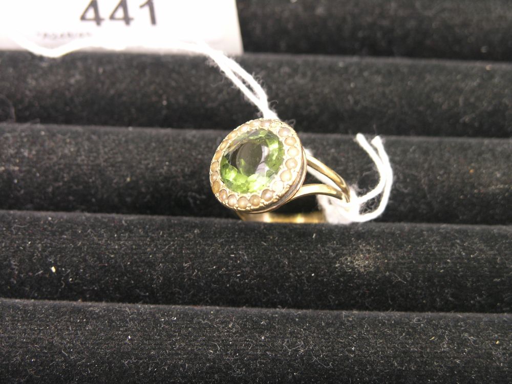 Appraisal: A ct gold dress ring set with central green stone