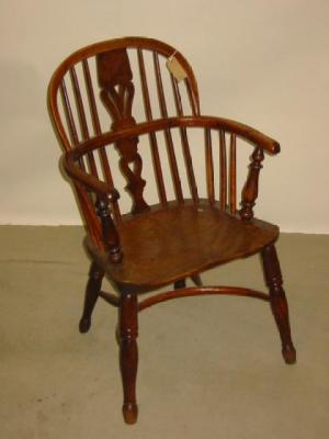 Appraisal: A YEW WINDSOR ARM CHAIR of low double hoop form