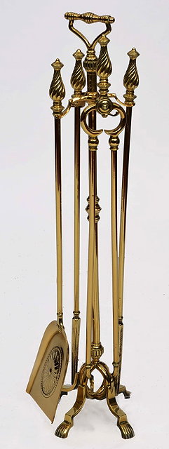 Appraisal: A SET OF FOUR BRASS FIRE IRONS ON STAND with