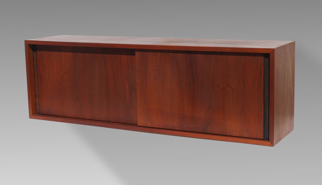 Appraisal: MID CENTURY HANGING WALL CABINET Teak wall cabinet with sliding