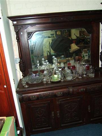 Appraisal: A Victorian mahogany dresser with raised mirrored back and column