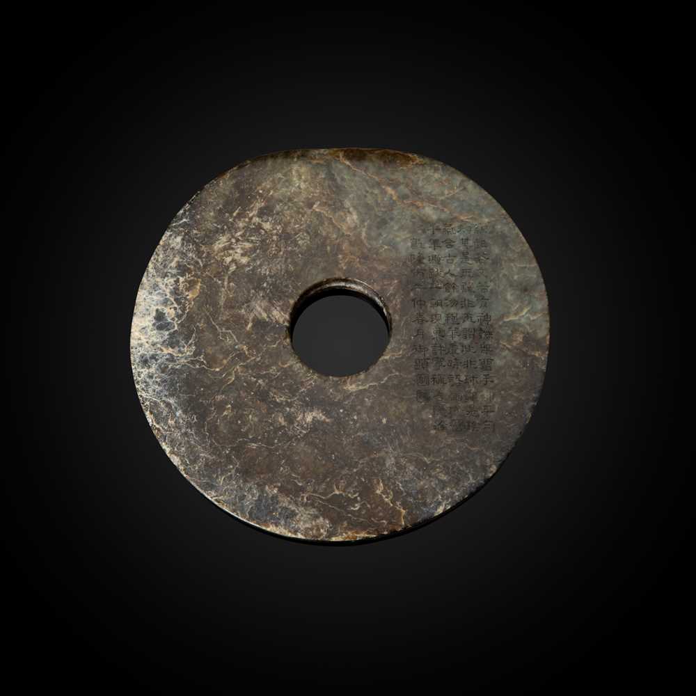 Appraisal: MOTTLED DARK BROWNISH-GREEN JADE DISC BI NEOLITHIC PERIOD LIANGZHU CULTURE