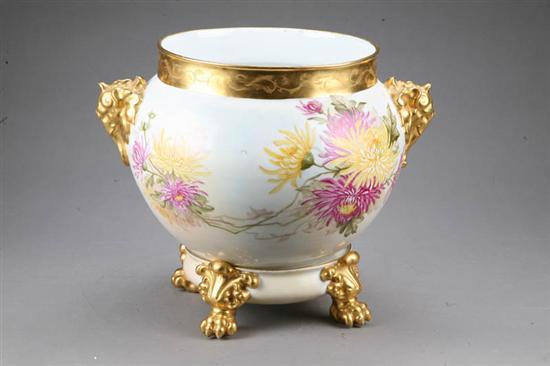 Appraisal: LARGE TWO PART JARDINIERE Porcelain with handpainted floral decoration gilt