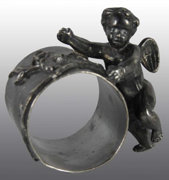 Appraisal: Cherub with Wings Figural Napkin Ring Description Tarnished No damage