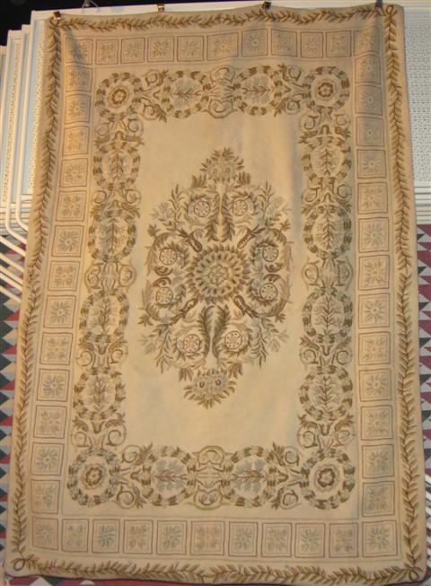 Appraisal: NEEDLEPOINT RUG WITH CREAM MEDALLIONS feet inches x feet inches