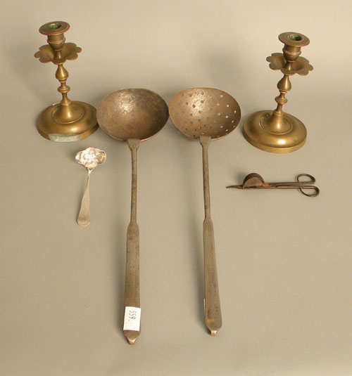 Appraisal: Metalware to include a pair of brass candlesticks ladle strainer