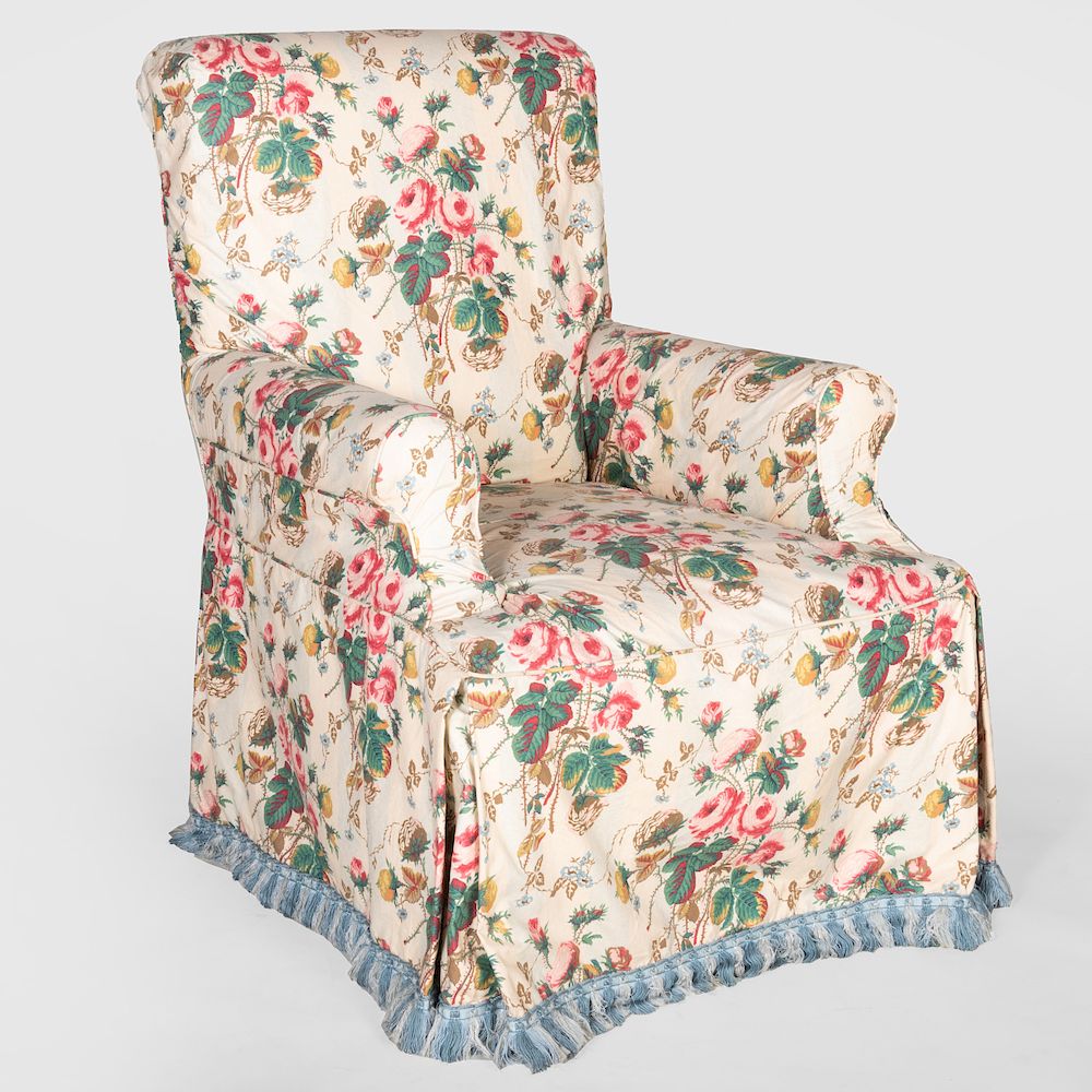 Appraisal: Chintz Slip Covered Armchair The slip cover with a fringe