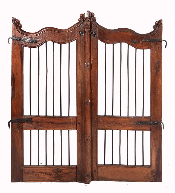 Appraisal: A PAIR OF GUJARATI HARDWOOD AND IRON GATES with scrolling