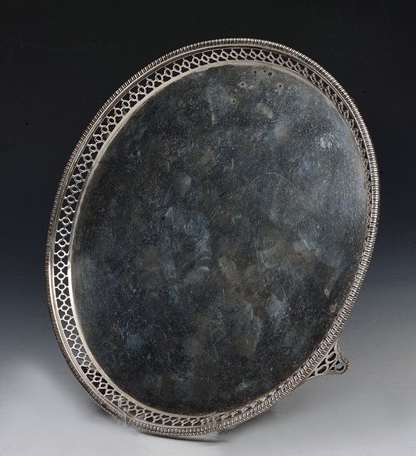 Appraisal: A SILVER SALVER with pierced and gadrooned border and standing