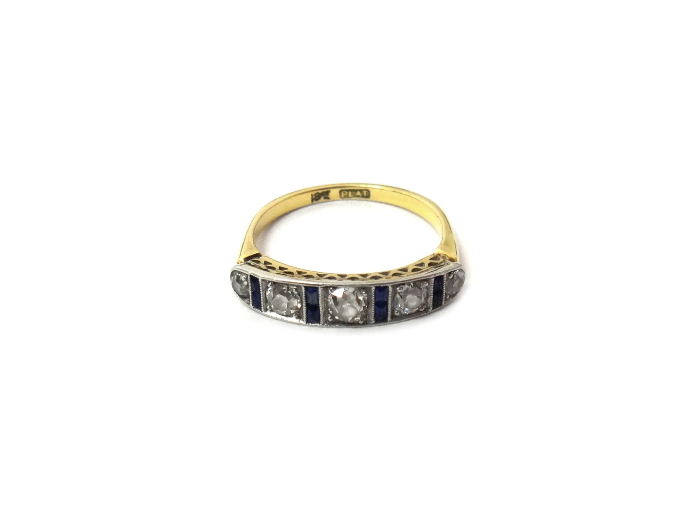 Appraisal: A gold and platinum ring mounted with a row of