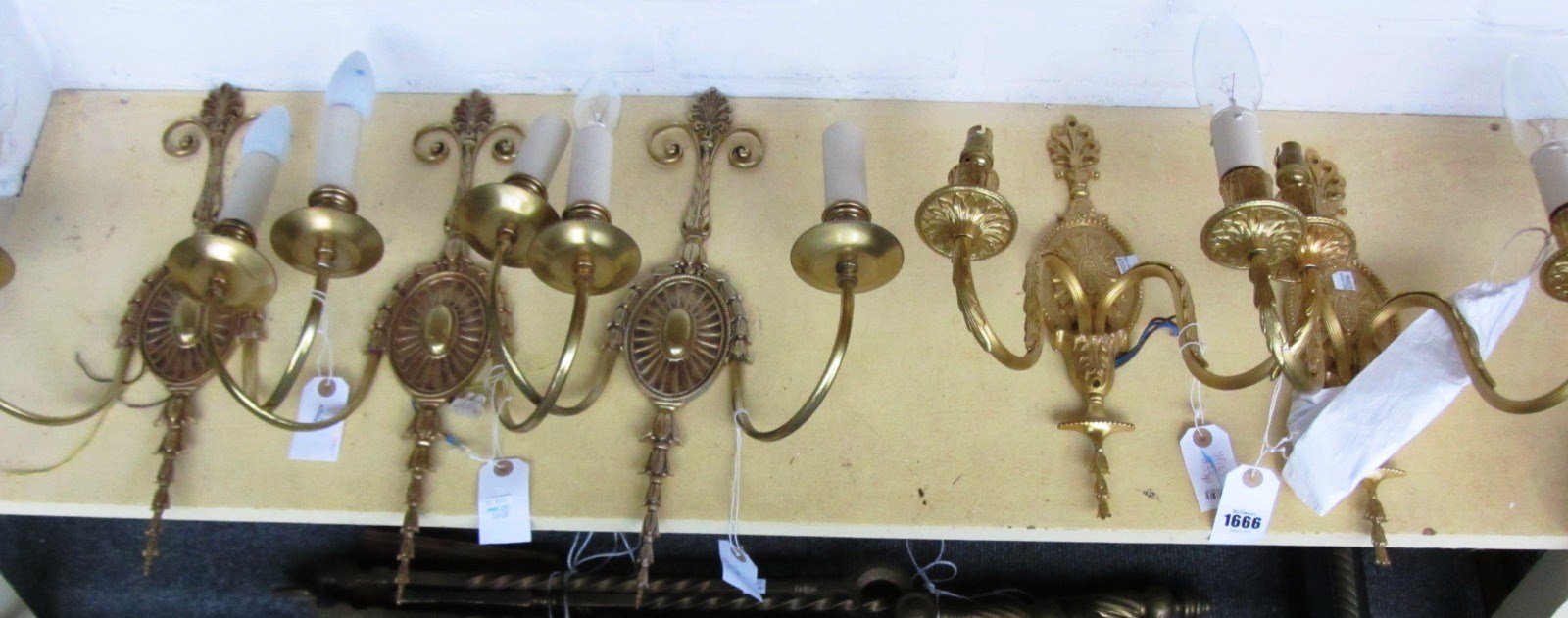 Appraisal: A set of seven gilt brass two branch wall lights