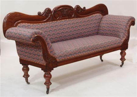 Appraisal: A large late Victorian mahogany framed sofa the foliate carved