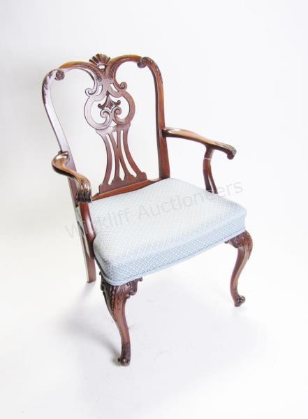 Appraisal: A carved Mahogany period-style arm chair with upholstered seat h