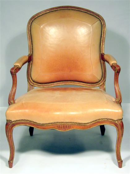 Appraisal: Louis XV style gilded and carved walnut fauteuil The arched