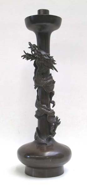 Appraisal: CHINESE BRONZE CANDLESTICK HOLDER with entwined dragon decoration Dimensions H