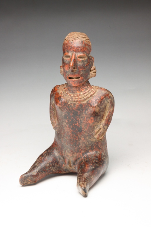 Appraisal: Jalisco terracotta seated female statue Back of head in unglazed