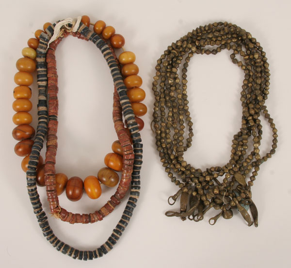 Appraisal: Nine strands of African necklaces including six brass two stone