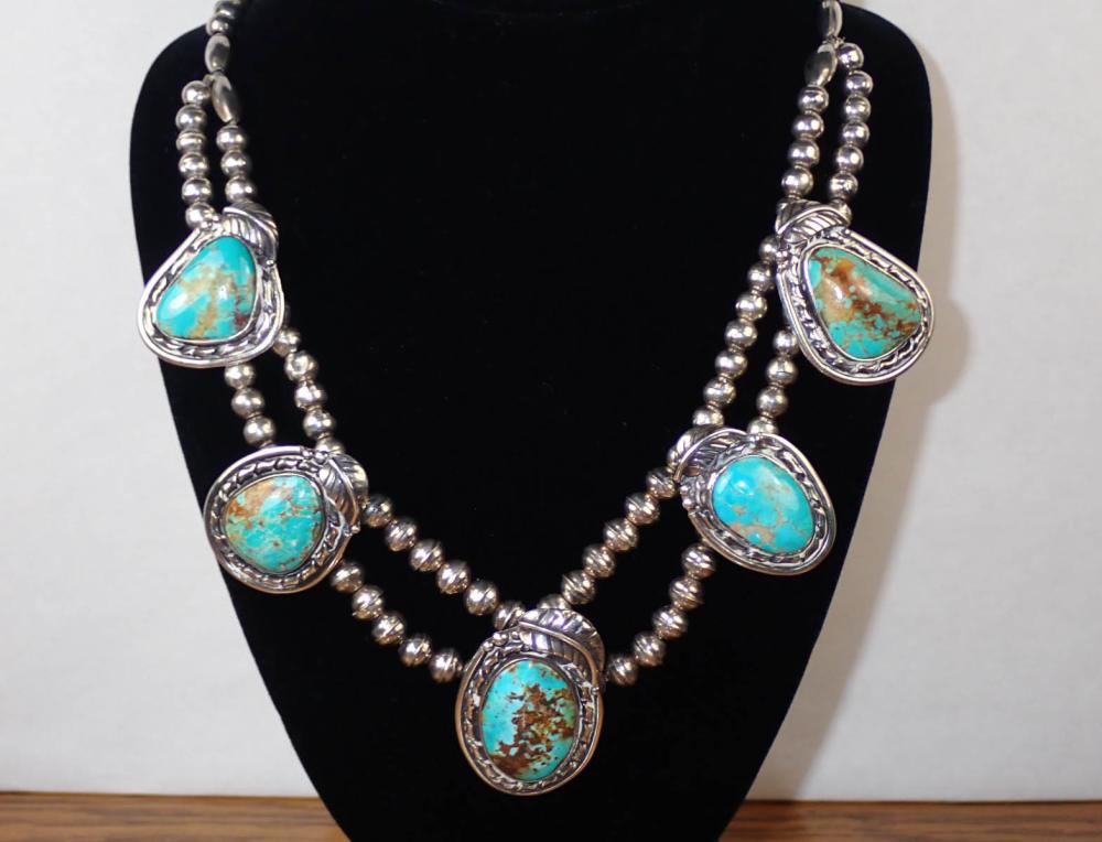 Appraisal: NATIVE AMERICAN SILVER TURQUOISE NECKLACE having two strands of silver