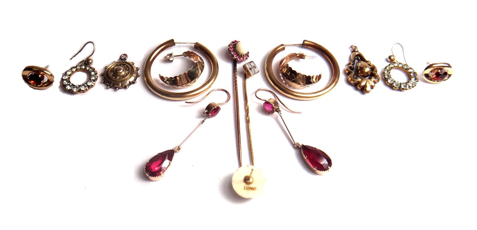 Appraisal: A gold stick pin mounted with four cushion shaped diamonds