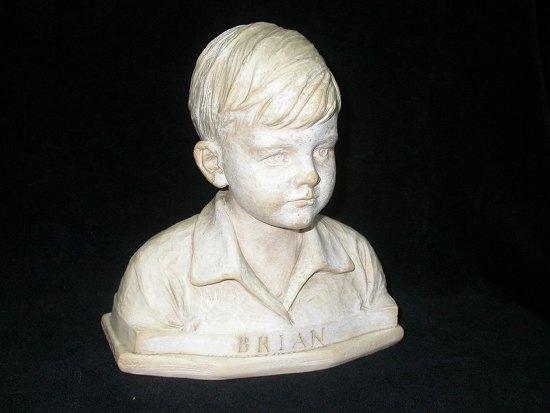 Appraisal: Alec MillerBriana bust of a boy looking slightly to his