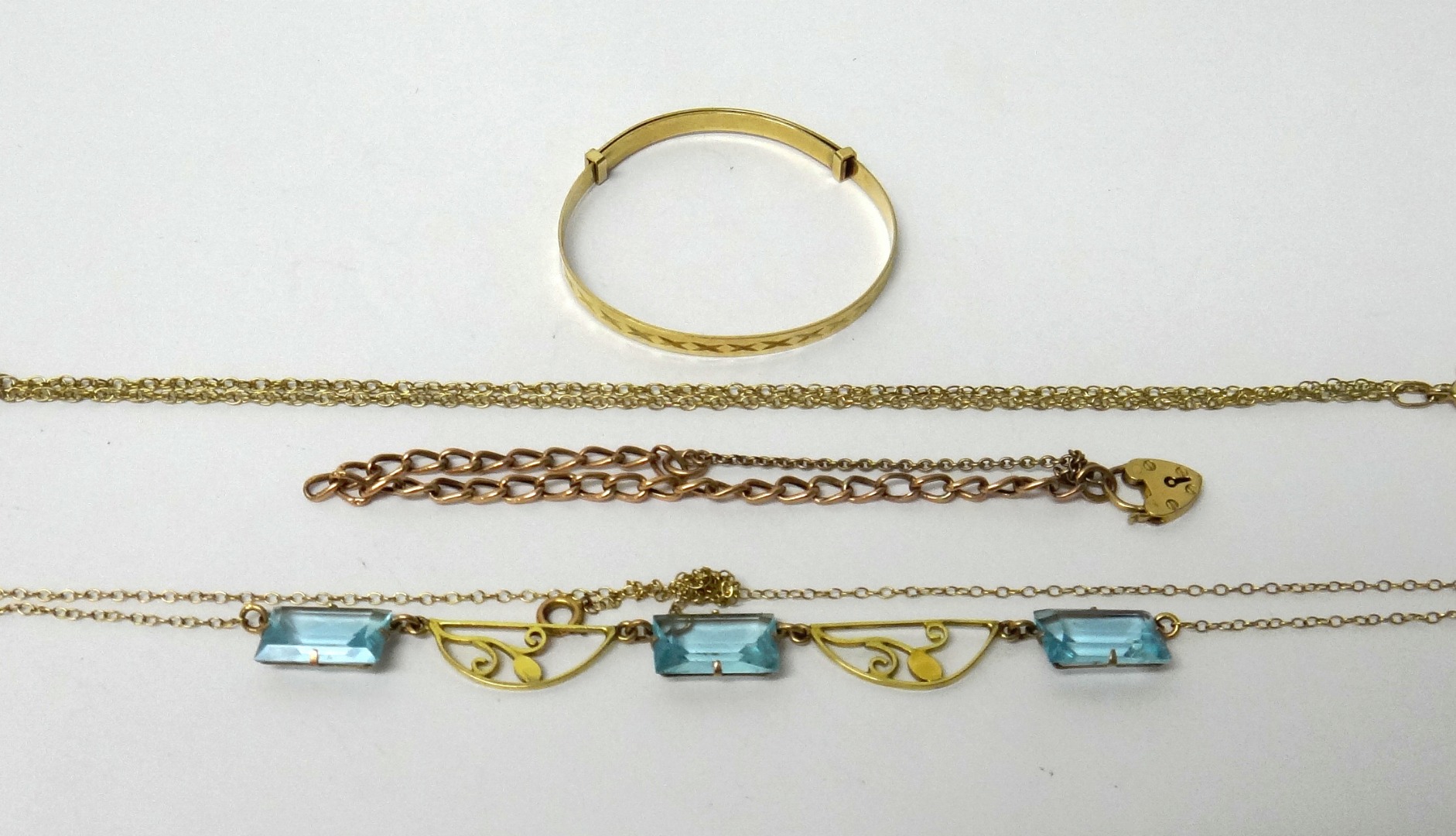 Appraisal: A gold and pale blue paste set necklace pierced with