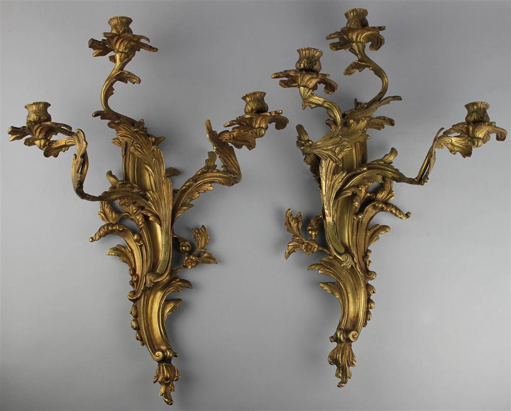 Appraisal: PAIR OF LOUIS XV STYLE GILT-BRONZE SCONCES each with three