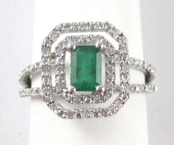 Appraisal: EMERALD DIAMOND AND FOURTEEN KARAT WHITE GOLD RING centering an