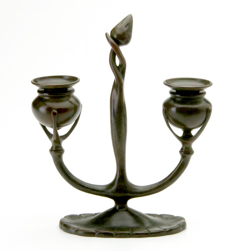 Appraisal: TIFFANY STUDIOS Bronze candleabra with tall swirled stem and oval