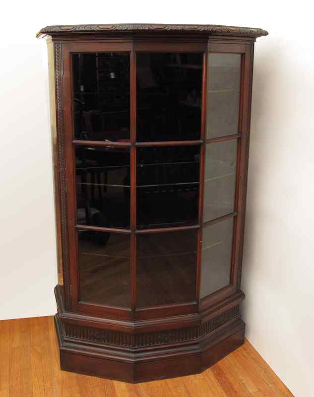 Appraisal: CIRCA MAHOGANY CURIO CABINET Canted sides front with panels interior