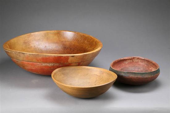 Appraisal: THREE WOOD BOWLS Large turned bowl with traces of old