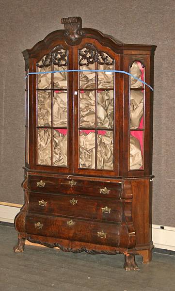 Appraisal: A Dutch Rococo style rosewood and walnut vitrine cabinet mid