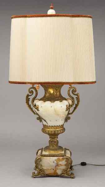 Appraisal: French cream onyx and ormolu mounted urnwired for use as