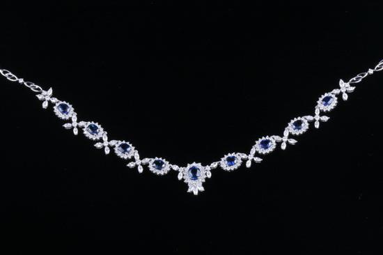 Appraisal: K WHITE GOLD SAPPHIRE AND DIAMOND NECKLACE Articulated necklace with