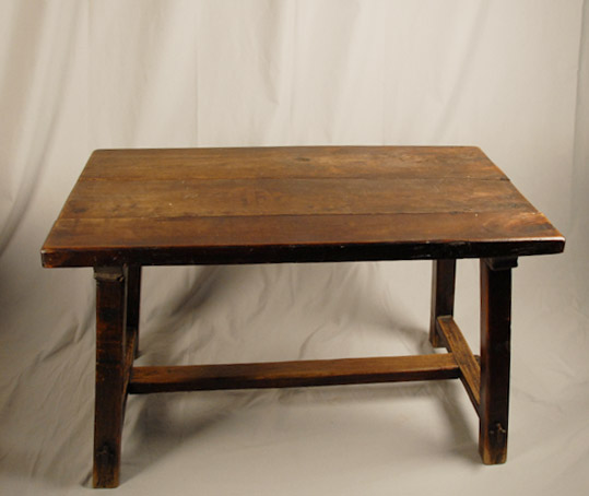 Appraisal: An Early Trestle Table having splay legs center stretcher peg