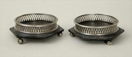 Appraisal: Pair of Directoire Silver Bottle Coasters on Ebonized Hexagonal Bases