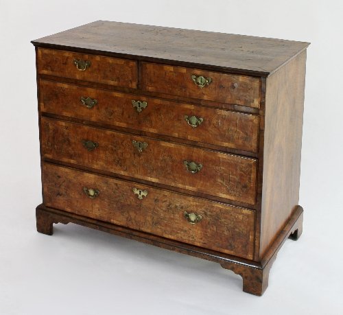 Appraisal: A Queen Anne walnut chest of drawers with banded top