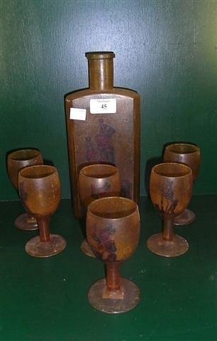 Appraisal: AN AMBER GLASS DECANTER and six wine glasses each decorated