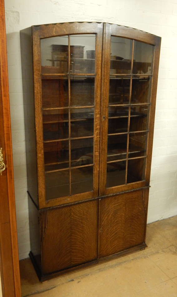 Appraisal: An oak Art Deco style bookcase or display cabinet with