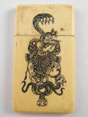 Appraisal: A Chinese ivory card case engraved and filled with figures