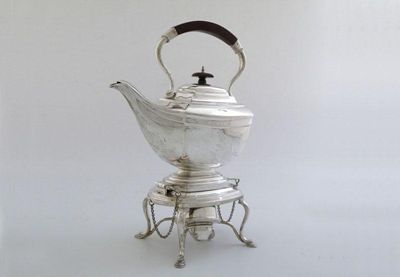 Appraisal: A silver kettle on stand of shaped rectangular form central