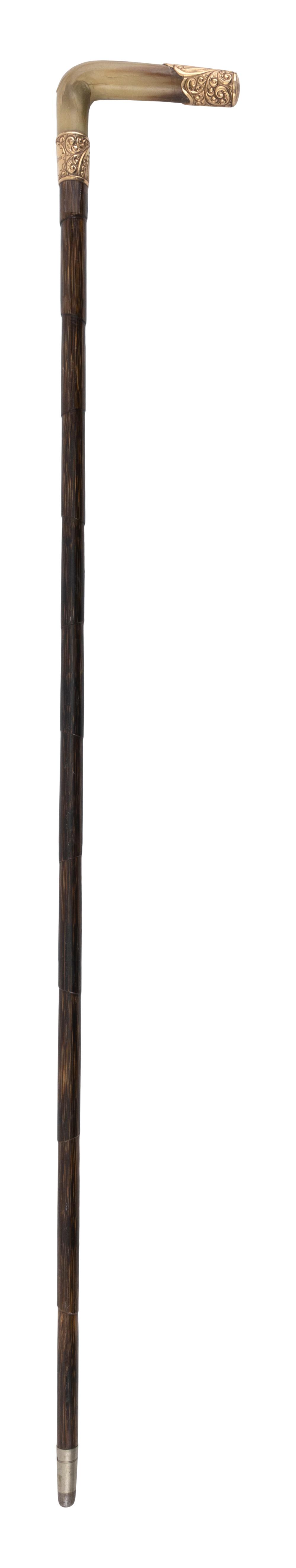 Appraisal: CANE WITH HORN AND GOLD HANDLE L -shaped horn handle