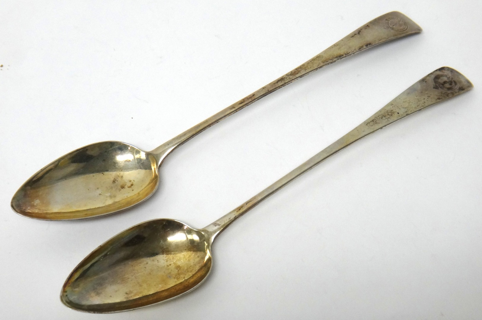 Appraisal: A pair of George III Scottish silver basting spoons each