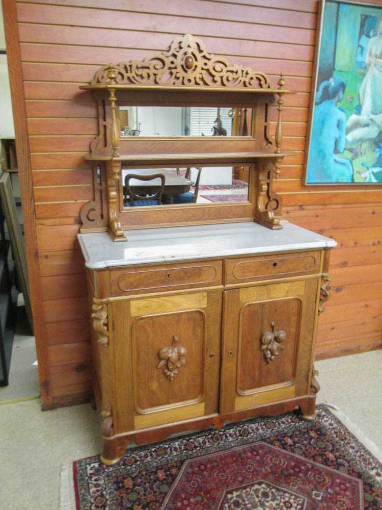 Appraisal: A VICTORIAN WALNUT SIDEBOARD American th century featuring an etagere