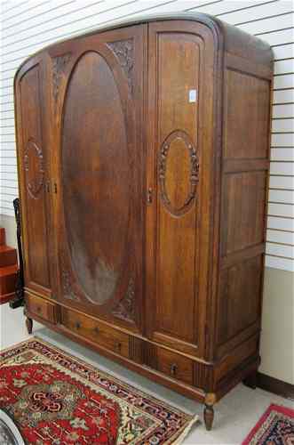 Appraisal: THREE-DOOR OAK WARDROBE Belgian early th century having an arch