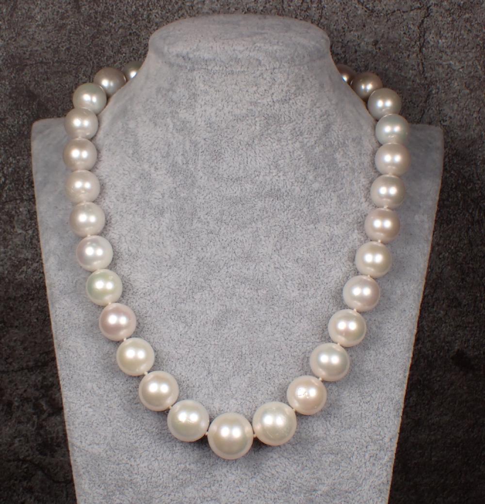 Appraisal: SOUTH SEA PEARL DIAMOND AND EMERALD NECKLACE The hand-knotted strand