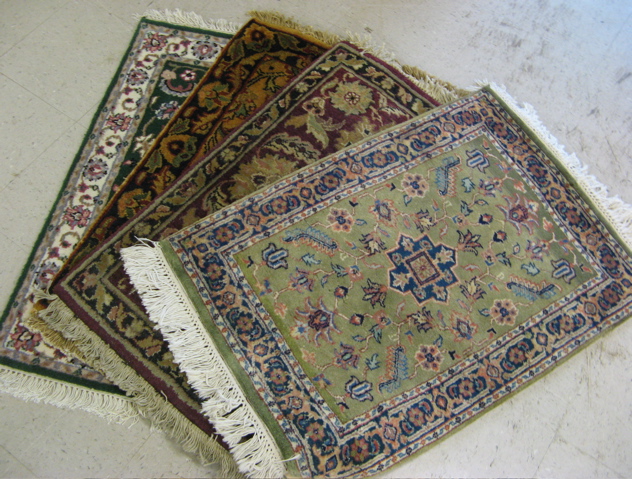 Appraisal: FOUR HAND KNOTTED ORIENTAL MATS Indo-Persian all about x feet